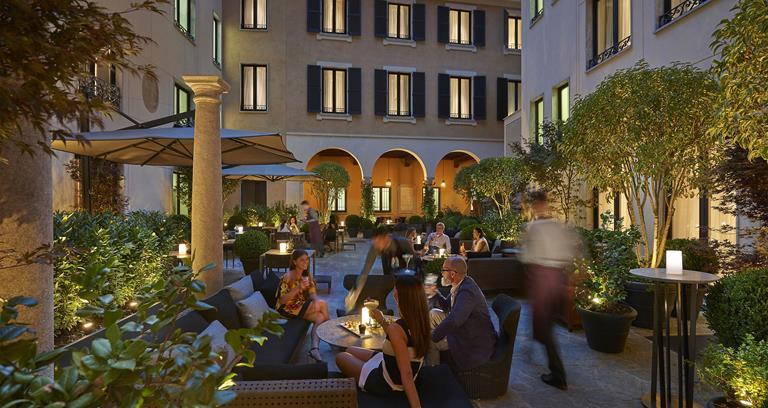 Mandarin Oriental Hotel Milan - Dining in the courtyard at dusk